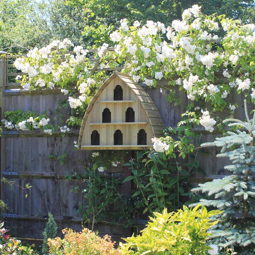 Durdle Door Six-Bay Wooden Dovecote amongst white roses