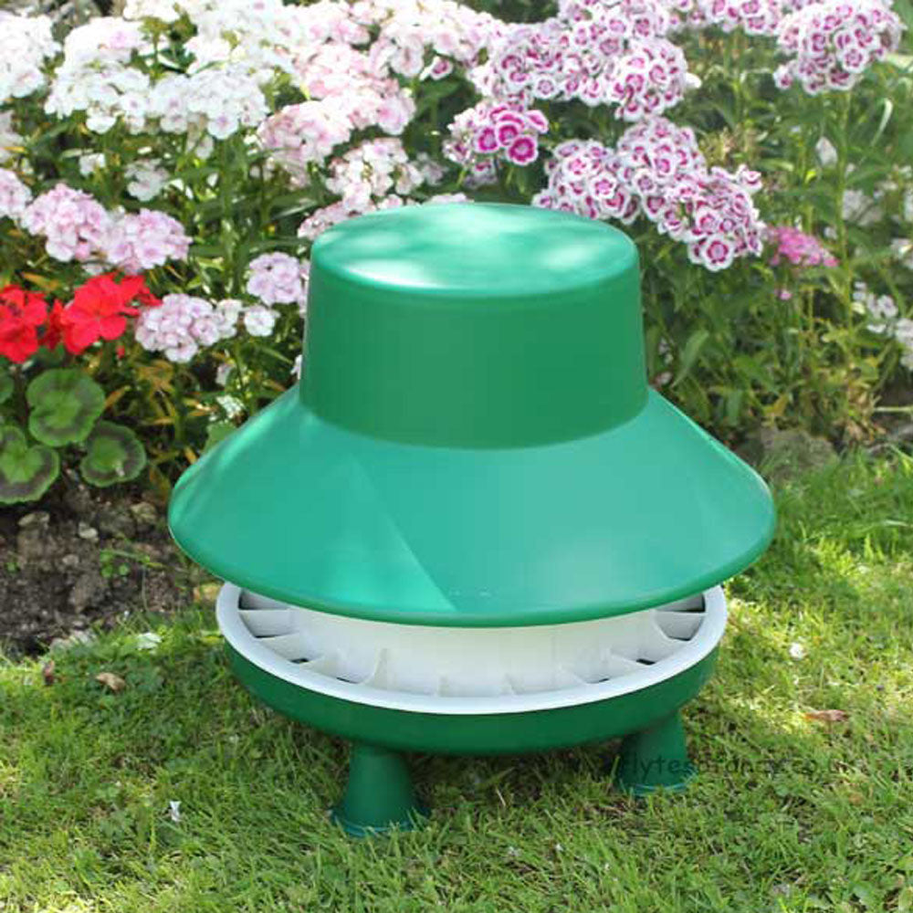 Blenheim Chicken Feeder with Rainhat in the garden