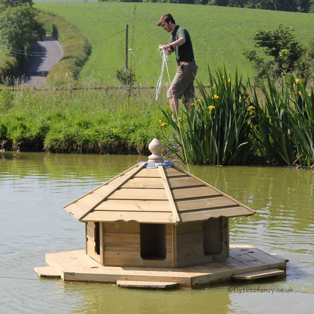 Floating Duck Lodge being anchored to the bank