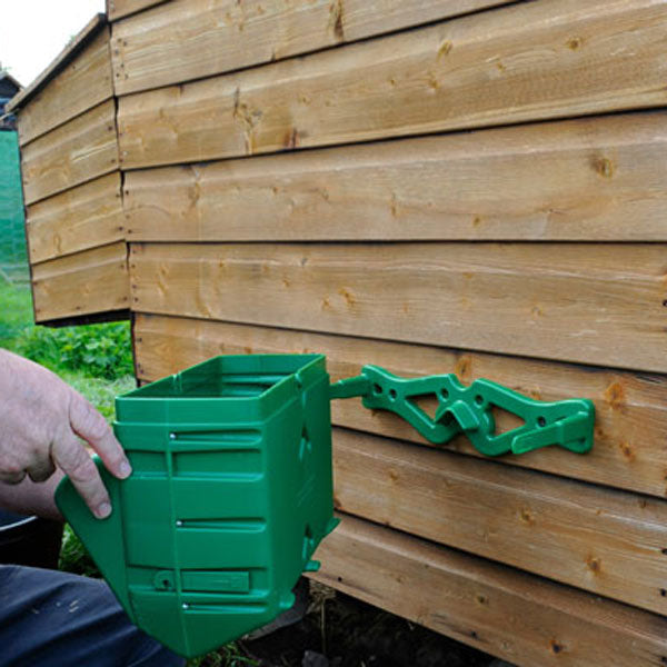 Mounting Bracket for Wise Poultry Feeders, mounted on chicken coop