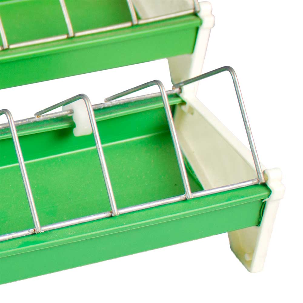 detail of Green Plastic Chick Feeder Trough