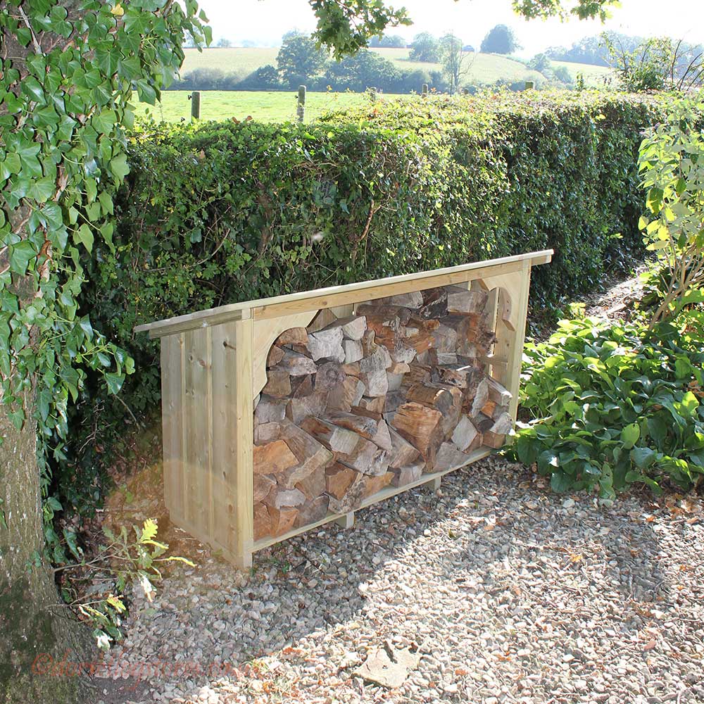 Melbury Log Store, 5ft wide by a hedge