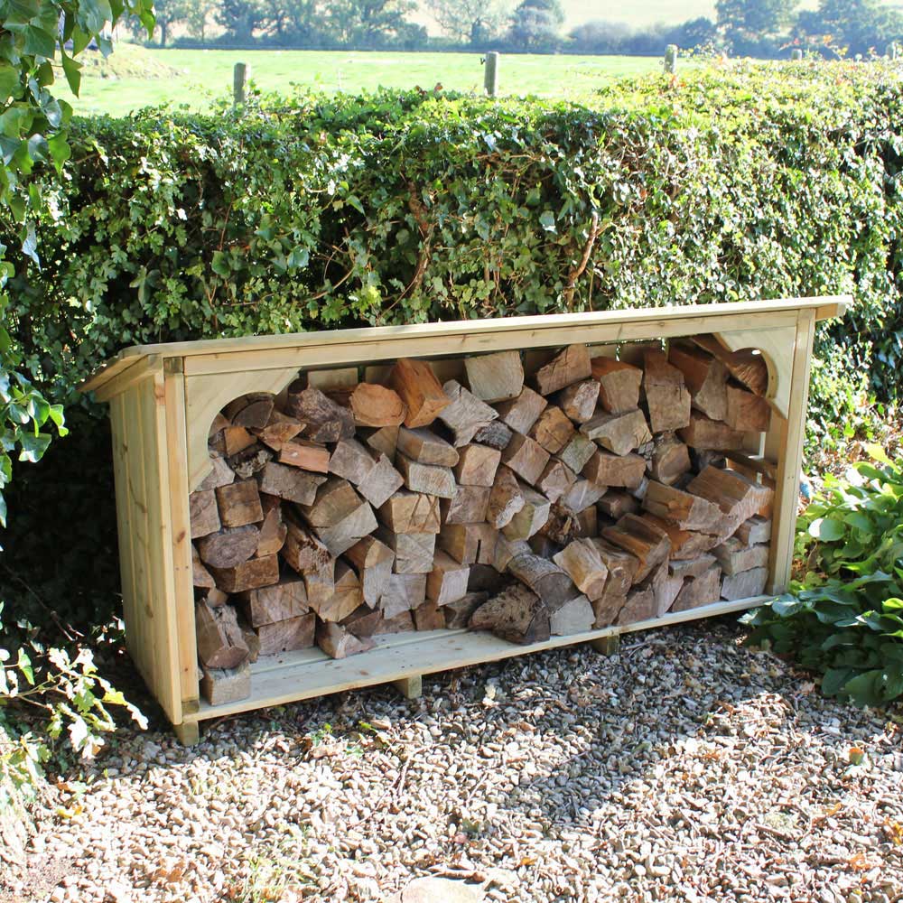 Melbury Log Store. 6ft wide under the hedge